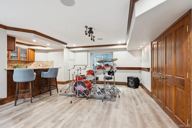 4059 Nevis St, Boulder, CO 80301 - workout area with a tray ceiling, light wood-style flooring, baseboards, recessed lighting, and crown molding