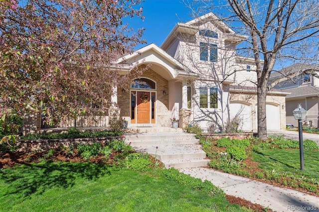 4059 Nevis St, Boulder, CO 80301 - traditional-style home with a front lawn, brick siding, driveway, and an attached garage