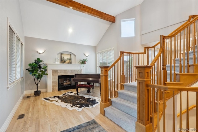 4059 Nevis St, Boulder, CO 80301 - stairway with beamed ceiling, wood finished floors, high vaulted ceiling, plenty of natural light, and baseboards