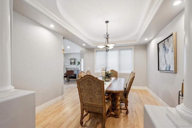4059 Nevis St, Boulder, CO 80301 - dining space featuring light wood-type flooring, a tray ceiling, baseboards, recessed lighting, and ornamental molding