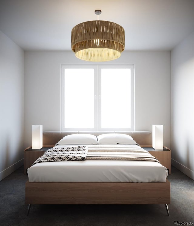 bedroom with dark colored carpet