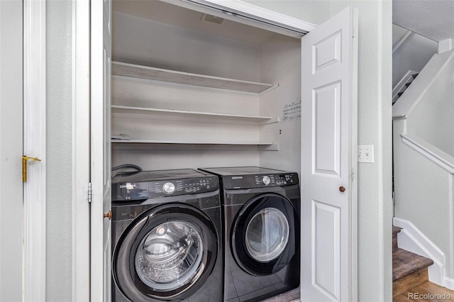 8199 Welby Rd Unit 4106, Denver, CO 80229 - laundry room featuring washer and clothes dryer and baseboards