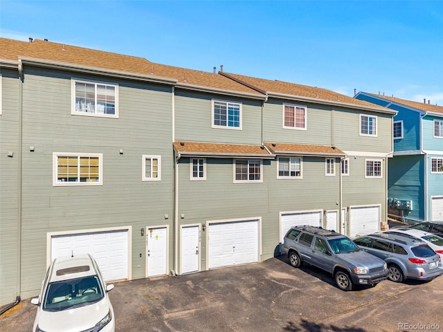8199 Welby Rd Unit 4106, Denver, CO 80229 - back of property with an attached garage and driveway