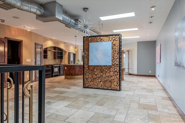 2150 Curtis St, Denver, CO 80205 - corridor with stone tile flooring, baseboards, and recessed lighting