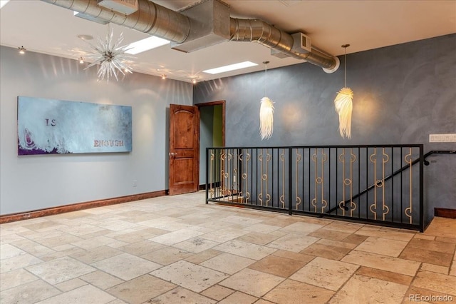 2150 Curtis St, Denver, CO 80205 - spare room with stone tile flooring and baseboards