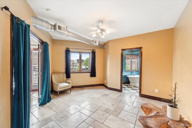2150 Curtis St, Denver, CO 80205 - unfurnished room with baseboards and stone tile floors