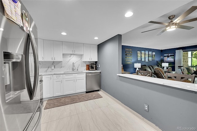 14300 E Marina Dr Unit 109, Aurora, CO 80014 - kitchen featuring stainless steel appliances, a sink, light countertops, a ceiling fan, and recessed lighting
