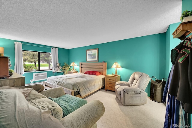 14300 E Marina Dr Unit 109, Aurora, CO 80014 - bedroom featuring carpet, a textured ceiling, and a wall mounted air conditioner