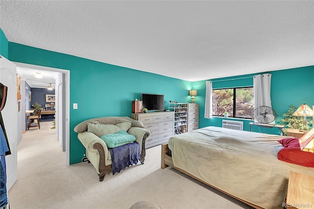 14300 E Marina Dr Unit 109, Aurora, CO 80014 - bedroom with carpet, a wall mounted AC, and a textured ceiling