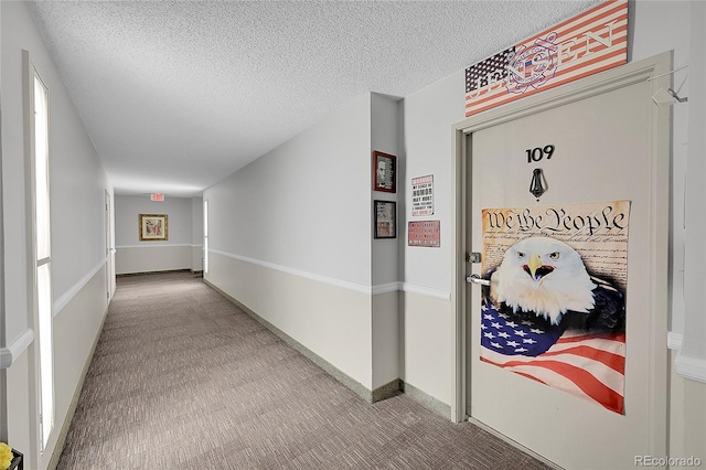 14300 E Marina Dr Unit 109, Aurora, CO 80014 - hall with carpet and a textured ceiling