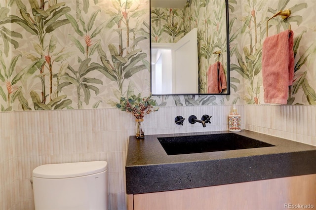 bathroom with vanity and toilet