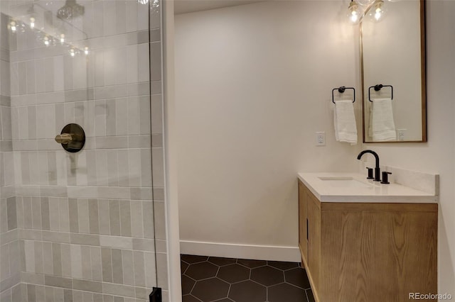 bathroom featuring tile patterned flooring and vanity