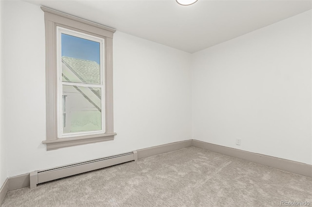 carpeted empty room with baseboards and baseboard heating