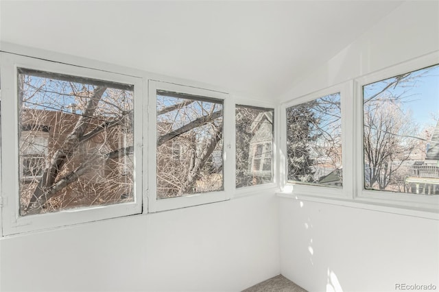 unfurnished sunroom with vaulted ceiling and a wealth of natural light