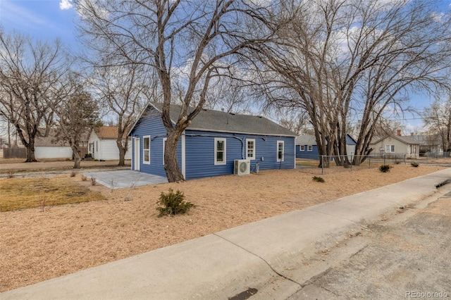 ranch-style house featuring ac unit