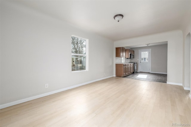 unfurnished living room featuring light wood-type flooring