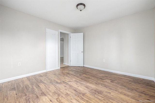 unfurnished bedroom featuring wood-type flooring