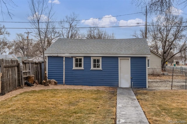 view of outbuilding with a yard