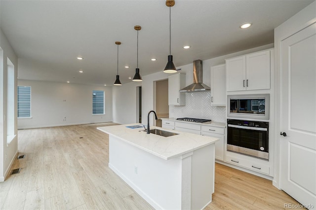 23708 E 42nd Ave, Aurora, CO 80019 - kitchen with stainless steel oven, a sink, wall chimney range hood, gas cooktop, and built in microwave