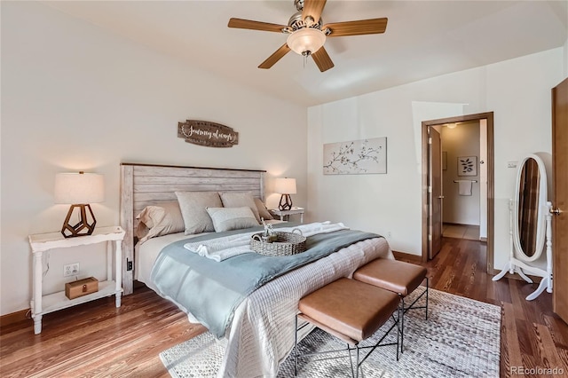 bedroom featuring wood finished floors, baseboards, and ceiling fan