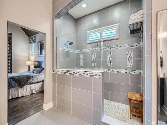 full bathroom featuring plenty of natural light, a walk in shower, and ensuite bathroom