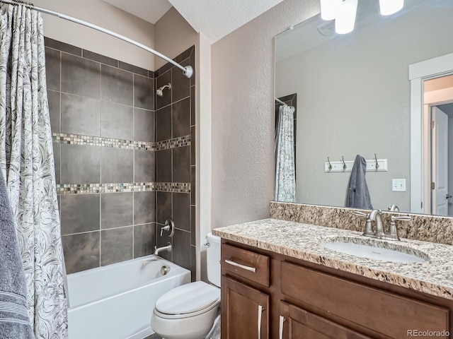 bathroom featuring vanity, shower / bath combination with curtain, toilet, and a textured wall