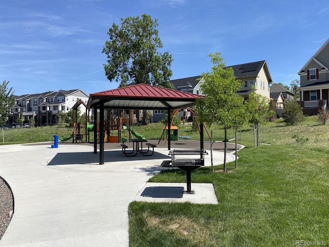 surrounding community featuring playground community, a lawn, and a residential view