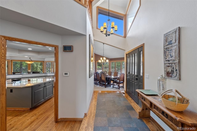 9 Red Fox Ln, Littleton, CO 80127 - foyer featuring a chandelier, plenty of natural light, baseboards, and a high ceiling