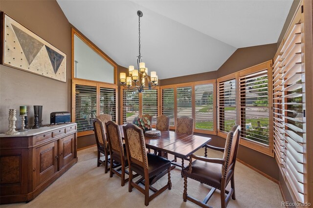 9 Red Fox Ln, Littleton, CO 80127 - dining space with light colored carpet, lofted ceiling, a chandelier, and baseboards