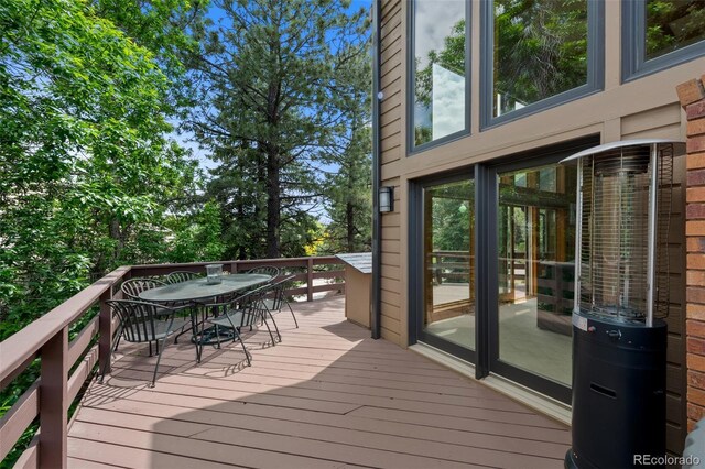 9 Red Fox Ln, Littleton, CO 80127 - wooden terrace with outdoor dining space
