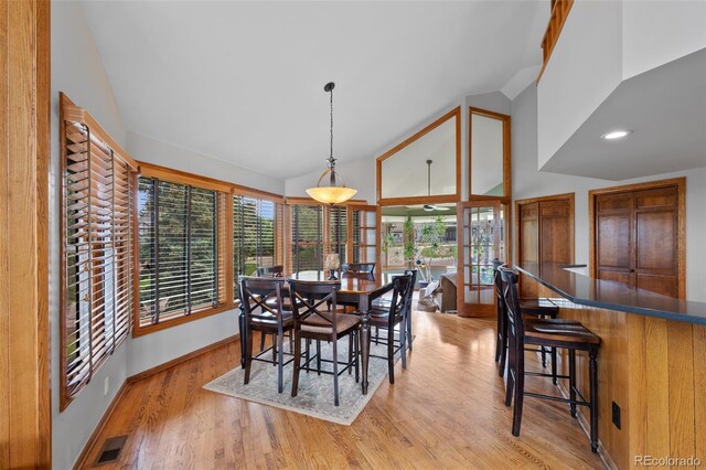 9 Red Fox Ln, Littleton, CO 80127 - dining area with high vaulted ceiling, light wood-type flooring, and baseboards