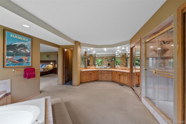 9 Red Fox Ln, Littleton, CO 80127 - full bath featuring double vanity, a stall shower, connected bathroom, a garden tub, and recessed lighting