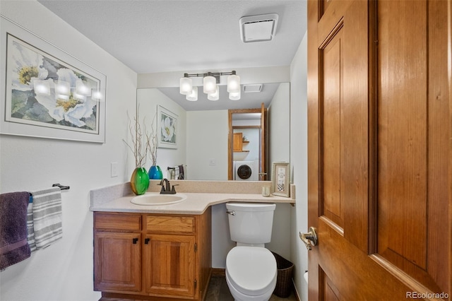 9 Red Fox Ln, Littleton, CO 80127 - half bath featuring washer / dryer, vanity, and toilet