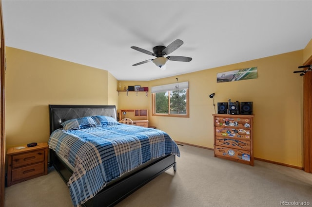 9 Red Fox Ln, Littleton, CO 80127 - bedroom with light colored carpet, baseboards, and a ceiling fan