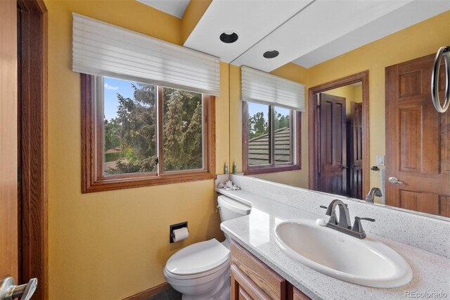 9 Red Fox Ln, Littleton, CO 80127 - bathroom with vanity, toilet, and baseboards