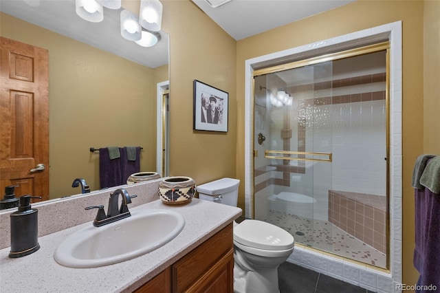 9 Red Fox Ln, Littleton, CO 80127 - full bathroom with toilet, a shower stall, vanity, and tile patterned flooring