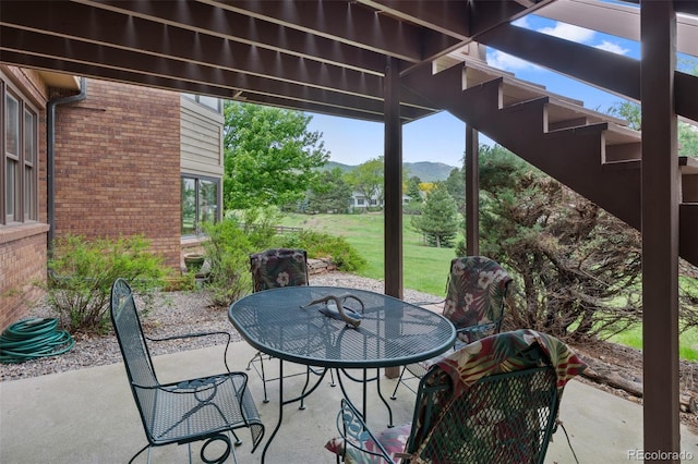 9 Red Fox Ln, Littleton, CO 80127 - view of patio / terrace with outdoor dining space and a mountain view