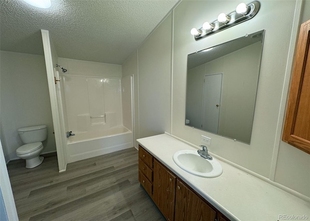 15125 Ewing Ct, Peyton, CO 80831 - full bathroom with wood finished floors, vanity, a textured ceiling, and tub / shower combination