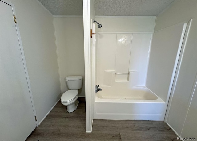 15125 Ewing Ct, Peyton, CO 80831 - full bath with a textured ceiling, wood finished floors, and tub / shower combination