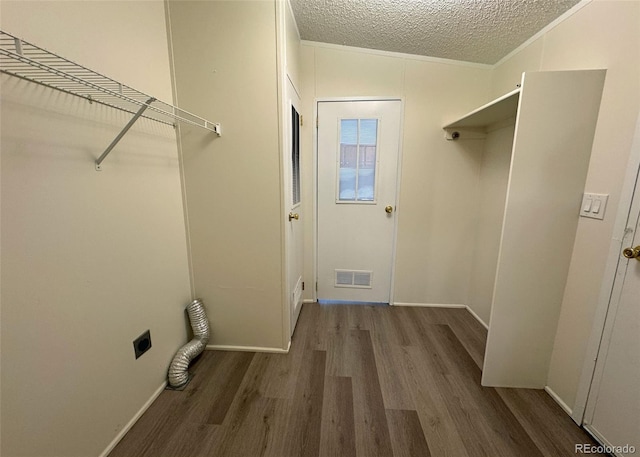 15125 Ewing Ct, Peyton, CO 80831 - washroom featuring electric dryer hookup, wood finished floors, a textured ceiling, and ornamental molding