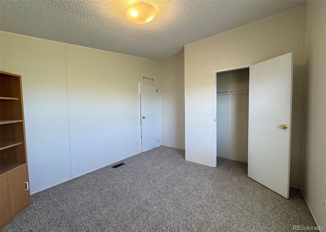 15125 Ewing Ct, Peyton, CO 80831 - unfurnished bedroom featuring a textured ceiling, carpet flooring, and a closet