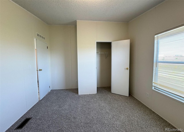 15125 Ewing Ct, Peyton, CO 80831 - unfurnished bedroom with carpet floors, a textured ceiling, and a closet