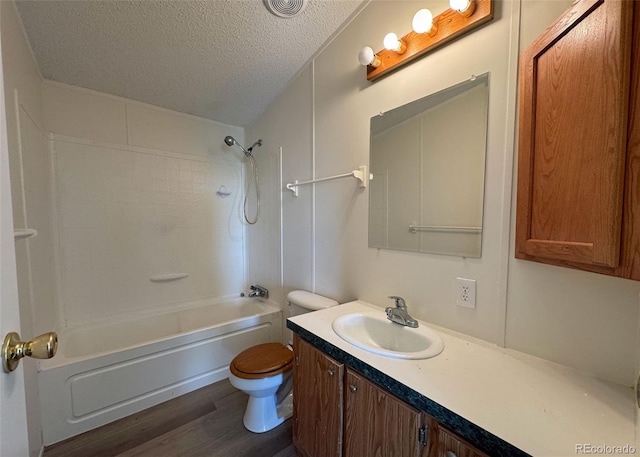 15125 Ewing Ct, Peyton, CO 80831 - full bath with a textured ceiling, vanity, bathing tub / shower combination, and wood finished floors