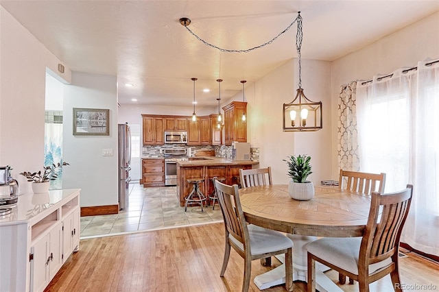 dining space featuring light hardwood / wood-style flooring