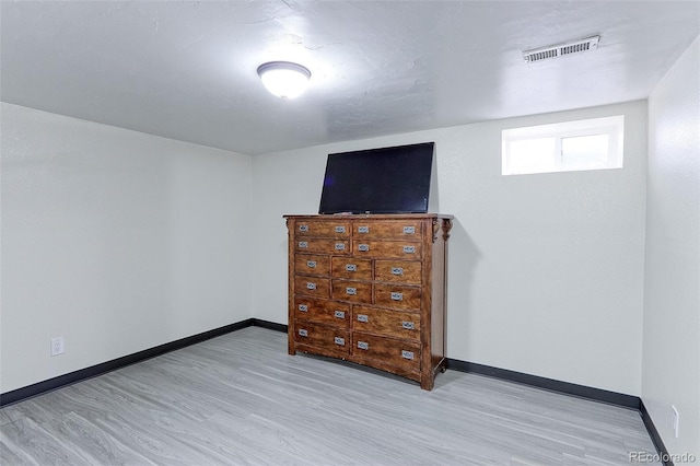 unfurnished bedroom featuring light hardwood / wood-style floors