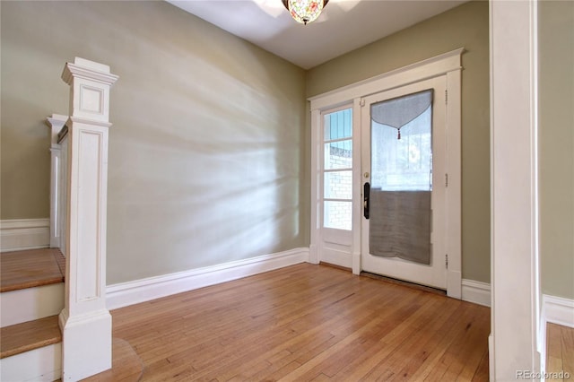 entryway with french doors and light hardwood / wood-style flooring