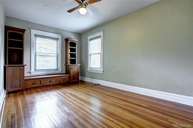 unfurnished room featuring ceiling fan and light wood-type flooring