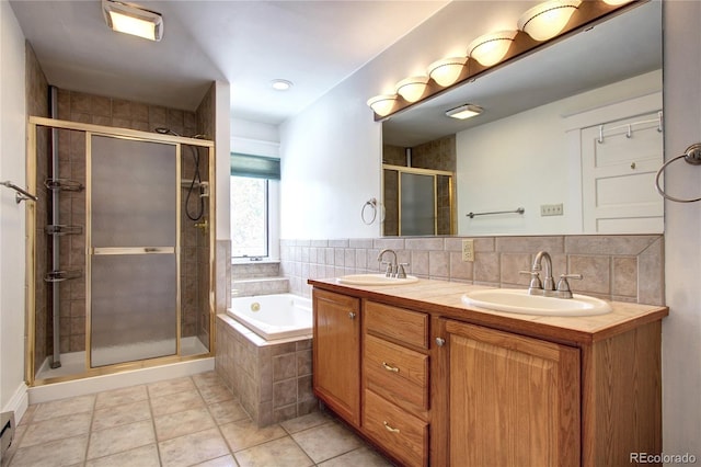 bathroom featuring tile patterned floors, tasteful backsplash, separate shower and tub, a baseboard radiator, and vanity