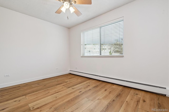 9340 E Center Ave Unit 1A, Denver, CO 80247 - unfurnished room with a baseboard radiator, light wood-type flooring, ceiling fan, and baseboards