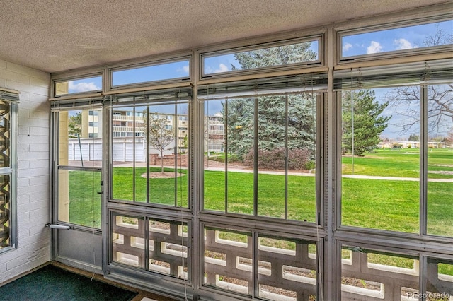 9340 E Center Ave Unit 1A, Denver, CO 80247 - unfurnished sunroom featuring a water view